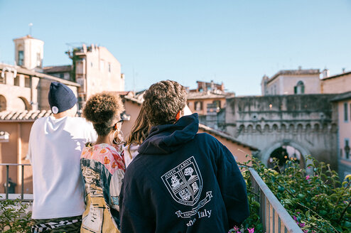 3 students looking into the distance